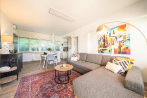 a living room with a couch and a table at Casa Sophie in Luino