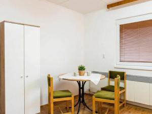 a small table and chairs in a room at Kechnec - Seňa in Kehnec