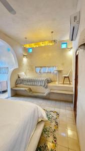 a bedroom with a large bed in a room at Calle Ouvert in Mérida +90 photos
