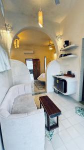 a living room with a couch and a table at Calle Ouvert in Mérida
