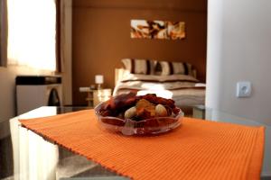 a bowl of food sitting on top of a table at Adél Apartman in Makó