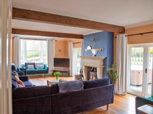 a living room with two couches and a fireplace at 7 Bed in Buxton oc-93808 in Tideswell