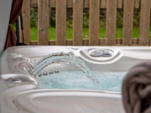 a sink with water coming out of it at 7 Bed in Buxton oc-93808 in Tideswell +32 photos