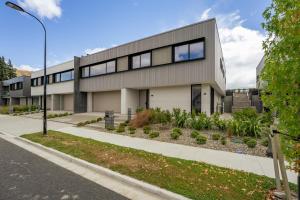 a building on a street with a street light at Rubus St Residence by Sothebys Luxury Rental Homes in Wanaka
