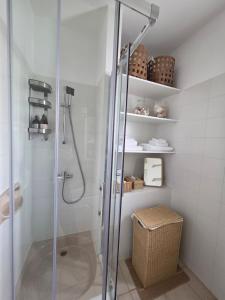 a shower with a glass door in a bathroom at SWeET LEMON VILLA in Protaras