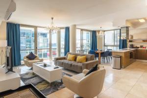 a living room with a couch and a table at V&A Waterfront Luxury by Nivar in Cape Town +88 photos
