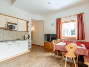 a kitchen and dining room with a table and chairs at Apartment Nr- 17 by Interhome in Solda