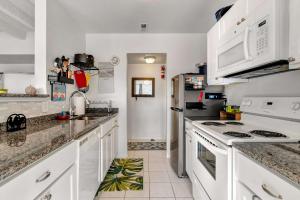 a kitchen with white counters and white appliances at Tiburon 5B in Ocean City +9 photos