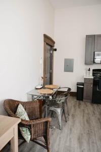 a kitchen with a table and chairs in a room at The Neighborhood Lofts in Greencastle