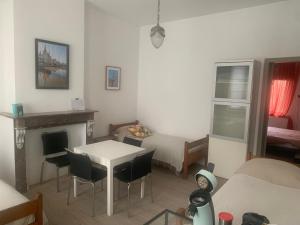 a living room with a table and a bed and a room at Dock Suites in Ghent +21 photos
