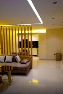 a living room with a couch and a table at La corniche in Kenitra