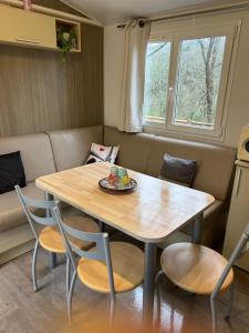 a dining room with a table and chairs at Mobil-home 1 in Quimper