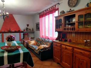 a living room with a couch and a table at B&B Meladormo in Tempio Pausania