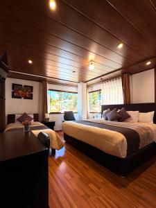 a bedroom with two beds in a boat at Allincay Cusco Apart Hotel in Cusco