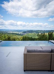 a swimming pool with a view of the mountains at Villa Gaia Novi Grad in Jablanica