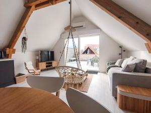 a living room with a couch and a table at Mackenheim - Parenthèse détente en Alsace - Terrasse & Parking in Mackenheim