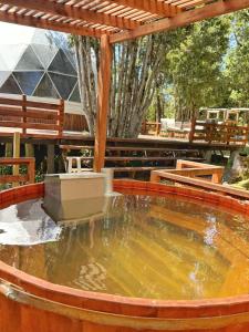 a large pool of water in a hot tub at Domo ancud glamping in Lechagua