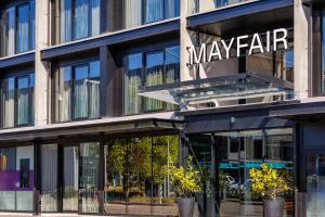 a building with a sign on the side of it at The Mayfair in Christchurch
