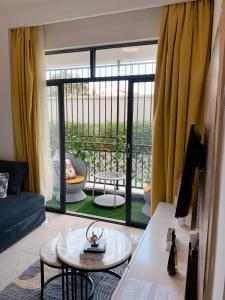 a living room with a view of a balcony at Carl's Peace Haven in Gachie