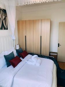 a bedroom with two beds with towels on them at Carl's Peace Haven in Gachie +25 photos