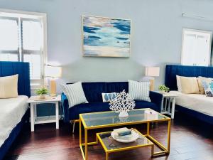 a living room with a couch and a table at Surf & Strand Unit B in Galveston