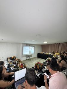 a group of people sitting at long tables with laptops at Hotel Casa del Hidalgo Centenario - Business & Leisure in Cali +41 photos