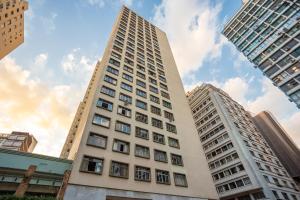 a tall building in the middle of some buildings at Edifício ASA- ASA001 in Curitiba