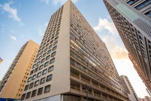 a tall building in the middle of buildings at Edifício ASA- ASA001 in Curitiba +10 photos