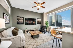 a living room with a couch and a table at Downtown Suite w/ Amazing Views in Cleveland