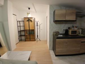 a kitchen with a counter top and a microwave at Bovisa home in Milan +1 photo