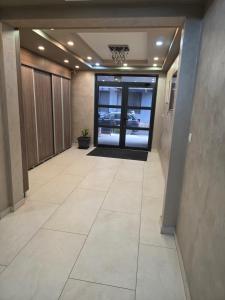 an empty hallway with a door in a building at Apartman Stars in Podgorica