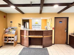 a restaurant with a counter in a room at Fairview Inn & Suites Whitewater in Whitewater