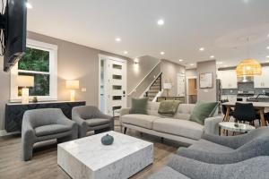 a living room with a couch and chairs and a table at Casa Belli in Bellingham