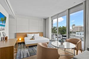 a hotel room with a bed and a view at Park Central South Beach in Miami Beach