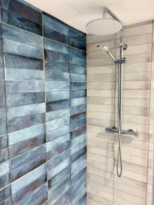 a bathroom with a shower with a glass wall at Cantinho D` Alice in Armamar +18 photos