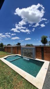 a swimming pool in the middle of a yard at Tajesdelsol in Luque
