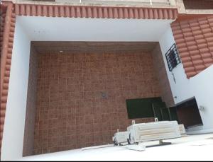 a bathroom with a brick wall and a sink at Enjoy Sevilla in La Rinconada