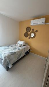 a bedroom with a bed and a window on the wall at Cartagena Serena Del Mar INAWA in Cartagena de Indias