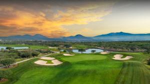 an aerial view of a golf course with mountains in the background at Executive Loft - Gym - Home Office - Zibatá in La Cañada