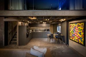 a room with a kitchen and a dining room at The Bells - Luxury Serviced Apartments in Leeds