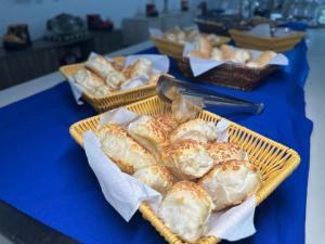 two baskets of bread on a blue table at Rincão Resort in São Paulo +16 photos