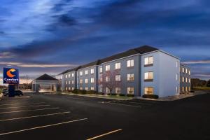 a rendering of a building in a parking lot at Comfort Suites Stevens Point in Stevens Point