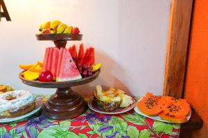 a tray of fruit on top of a table at Do Parque Pousada in Penha