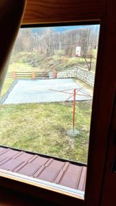 a view of a basketball court from a window at Apartment Mateja in Mokra Gora