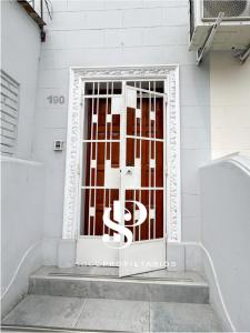 a door with a metal gate on a building at Casa Águila y Cóndor Miraflores in Lima +9 photos