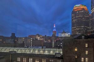 a view of a city skyline at night at Central Downtown Condo | Parking & Pool Table in Cleveland