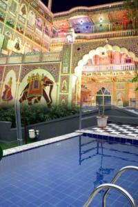 an indoor swimming pool with a mural of an elephant at Hotel Shekhawati Mandawa in Mandāwa