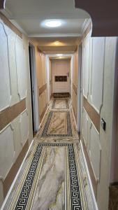 an empty hallway with a tile floor in a room at Cinderella dahabya in Luxor