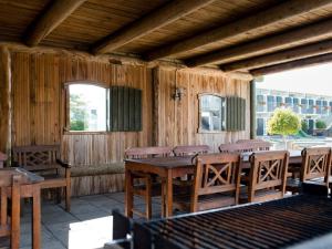 a wooden dining room with a table and chairs at 4 person holiday home on holiday park in Glesborg in Glesborg +46 photos