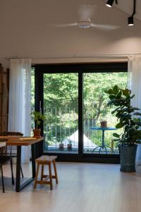 a living room with a large window and a table at 연봉리 스테이 in Hongcheon +74 photos